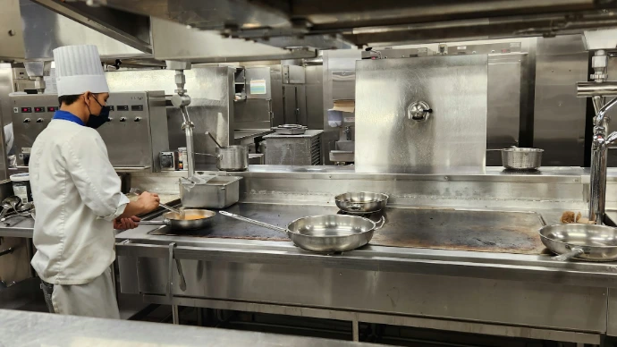 a chef cooking in a kitchen